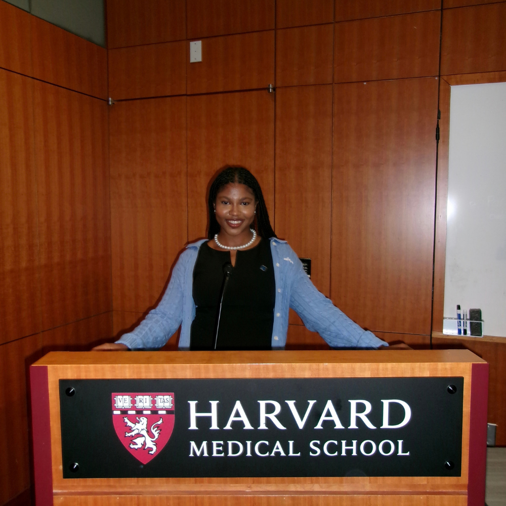 Wilson behind podium at Harvard Medical School 